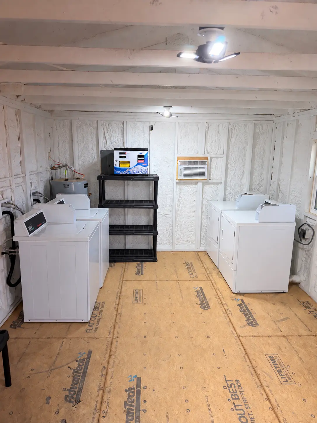 The clean on-site laundry room with Speed Queen washers and dryers